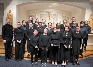 Members of the Marymount University Chamber Singers stand together in the chapel.
