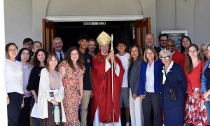 Students pose alongside Bishop Burbidge, Jill MMcCabe, President Becerra, Evan Lipp, Josh Harless, and Father Gabriel after the Mass of the Holy Spirit.