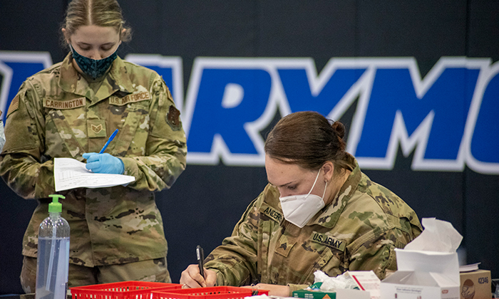 Members of the Army National Guard distributing COVID-19 vaccines at Marymount's clinic