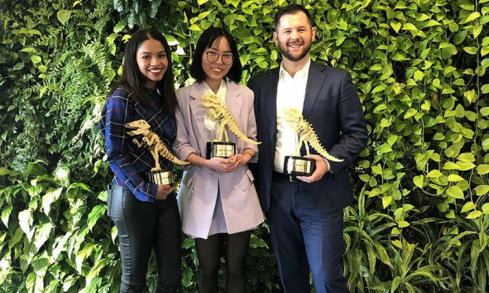 Tran Truong, center, after winning the 2020 WindowsWear competition with COACH, alongside fellow finalists and Marymount University students Shantell Reyes and Daniel Schrei.
