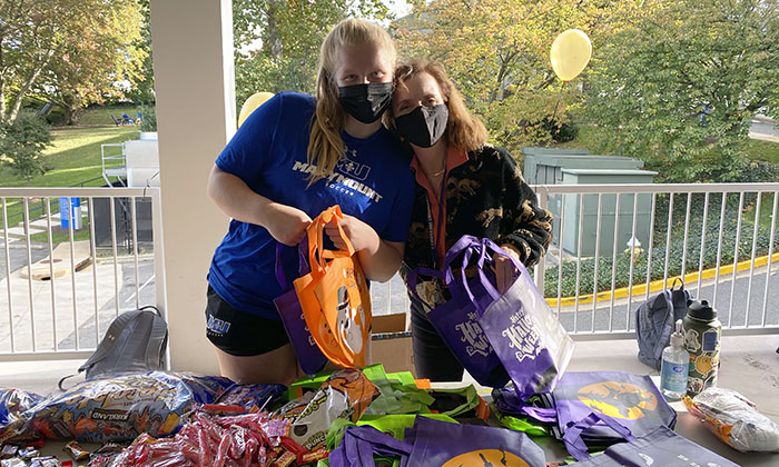 Marymount University students assemble goodie bags during Halloween Fest