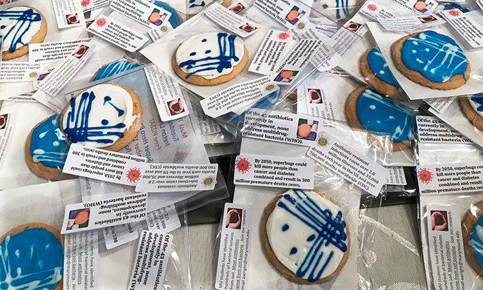 Cookie decorating event at Marymount University with information on the dangers of superbugs.