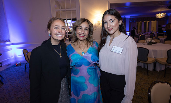 Erin Cannon, left, and Sadaf Ehsanyar, right, with President Becerra