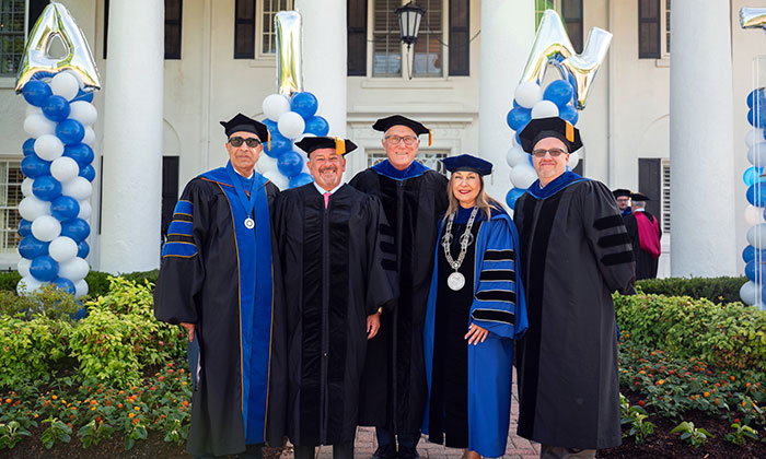 Raul Fernandez (second from left) and alumni speaker Ian Hopper (far right) with Marymount's Board Chair, President and Provost