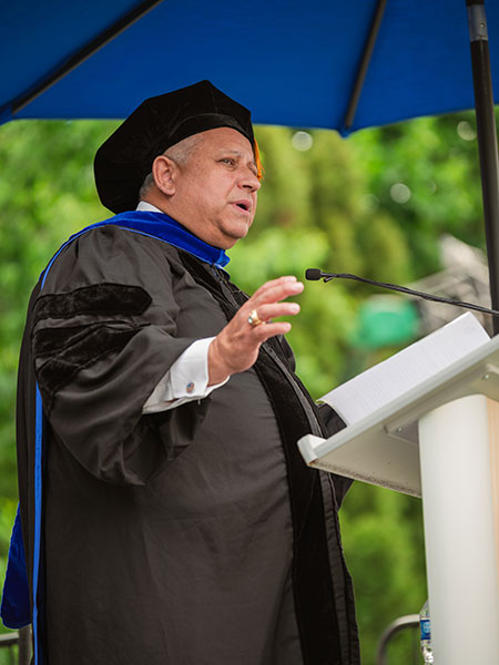 Carlos Del Toro delivers remarks in the College of Sciences and Humanities commencement ceremony