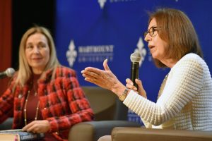 Marymount President Irma Becerra and Marie Arana, Literary Director of the Library of Congress and author, sit on stage during a lecture.