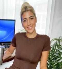 Nuha El- Quesny smiles for a headshot.