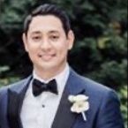 Robert Zahn Jr. smiles for a photo in a tuxedo.
