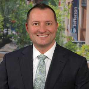 Jeff Doucette smiles for a headshot