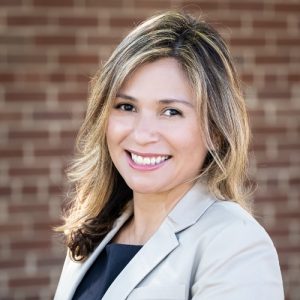Claudia Chase smiles for a headshot