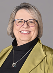 Toni Ardabell smiles for a headshot.