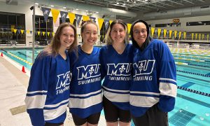 Craig (right center) with other members of Marymount’s Swimming Team