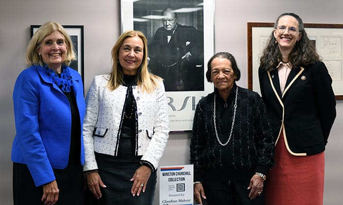 From left to right: Dr. Griffith, President Becerra, Malone and Dr. Fitch gather in the Reinsch Library to view the newly installed Churchill collection
