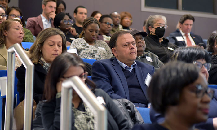 An audience of displaced federal workers and contractors at Marymount's Ballston Center