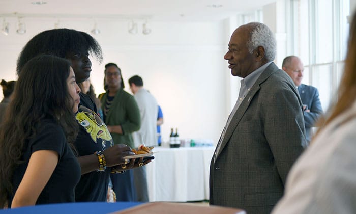 James Dyke speaks with Marymount community members during a reception following the Voices of Purpose episode recording