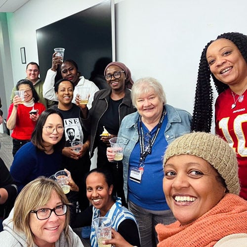 From Caregiver to Breadwinner Program participants celebrating with Dr. Diane Murphy
