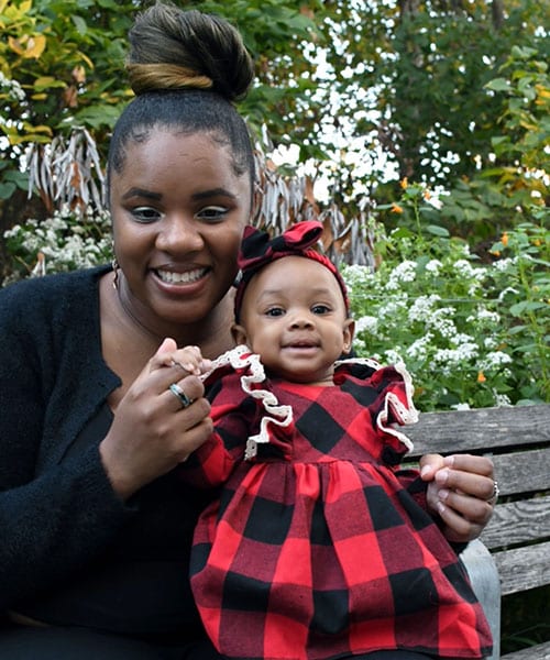 Zenda Daniels, student in Cohort III of the From Caregiver to Breadwinner Program, with her daughter