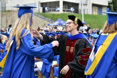 Asst.-Professor-Dr.-Amy-Allnutt-hugs-a-graduating-student-at-the-2022-Commencement-Ceremony-for-the-College-of-Health-and-Education